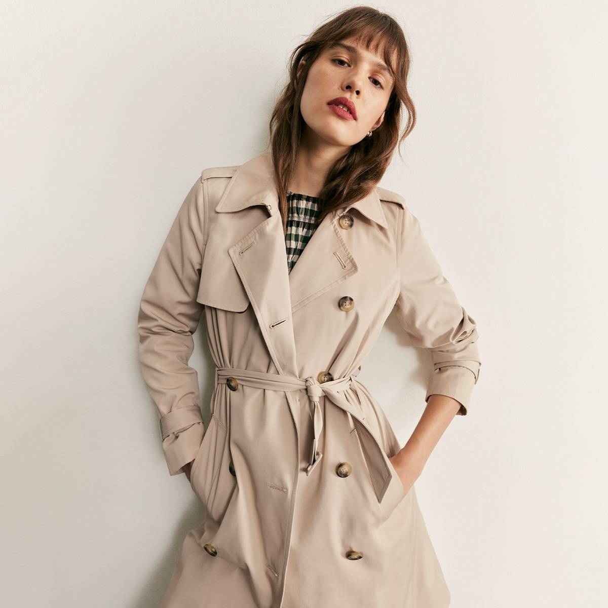 Woman wearing beige trench coat 